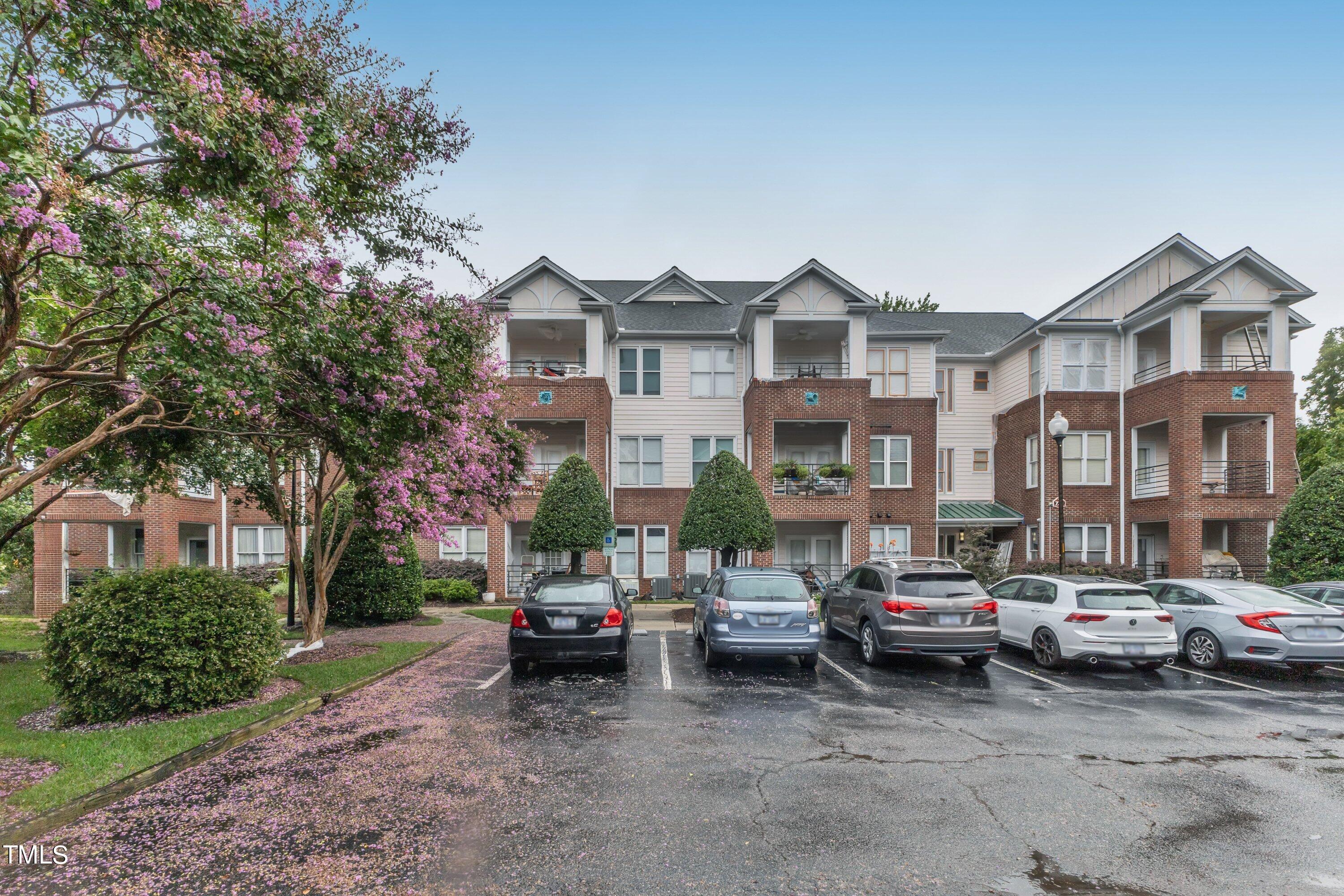 720 North Person Street, Unit 306 Raleigh, NC 27604 - Photo 13 of 13 a city street lined with buildings and cars