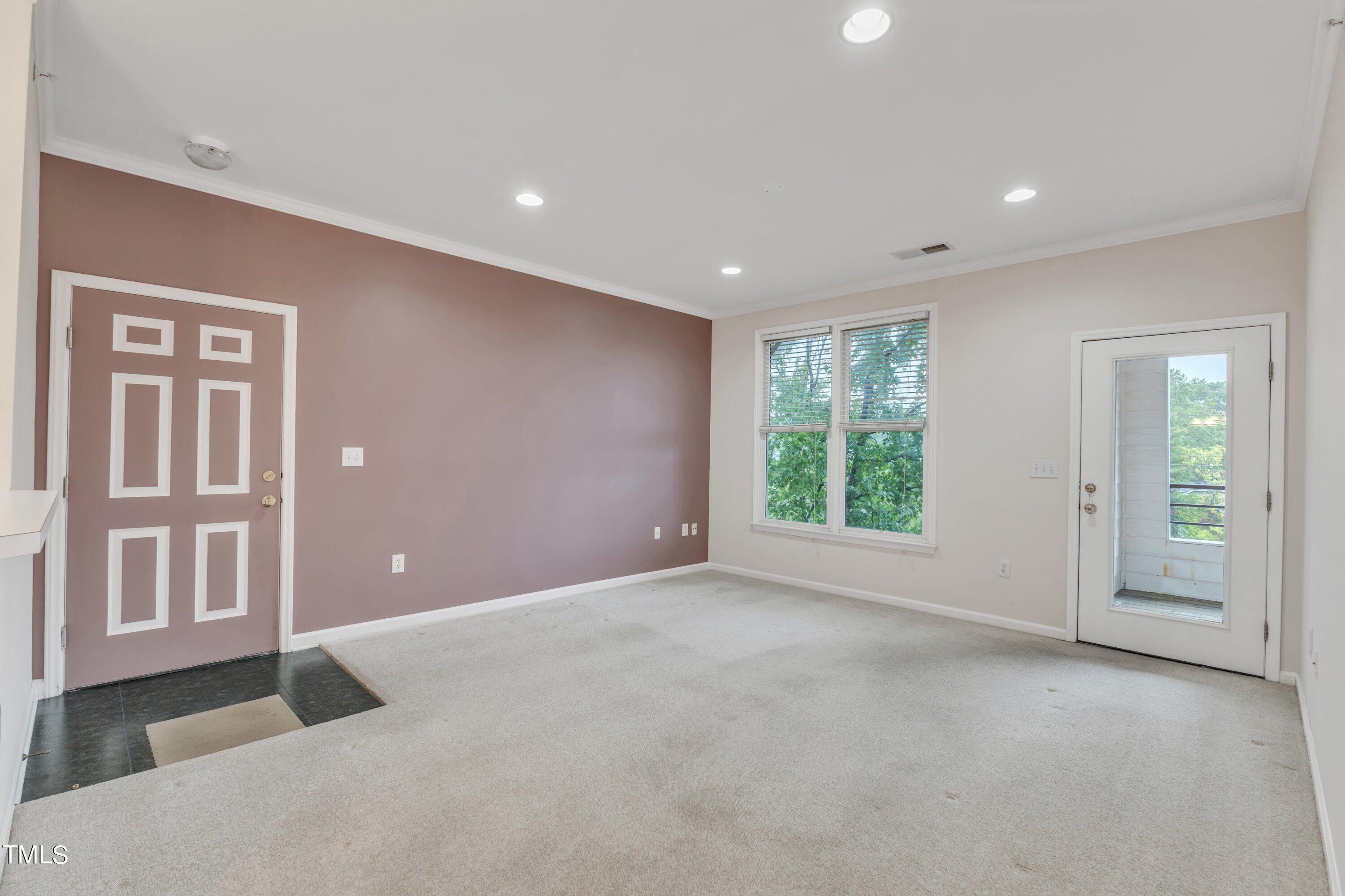 720 North Person Street, Unit 306 Raleigh, NC 27604 - Photo 3 of 13 a view of a livingroom with an entryway
