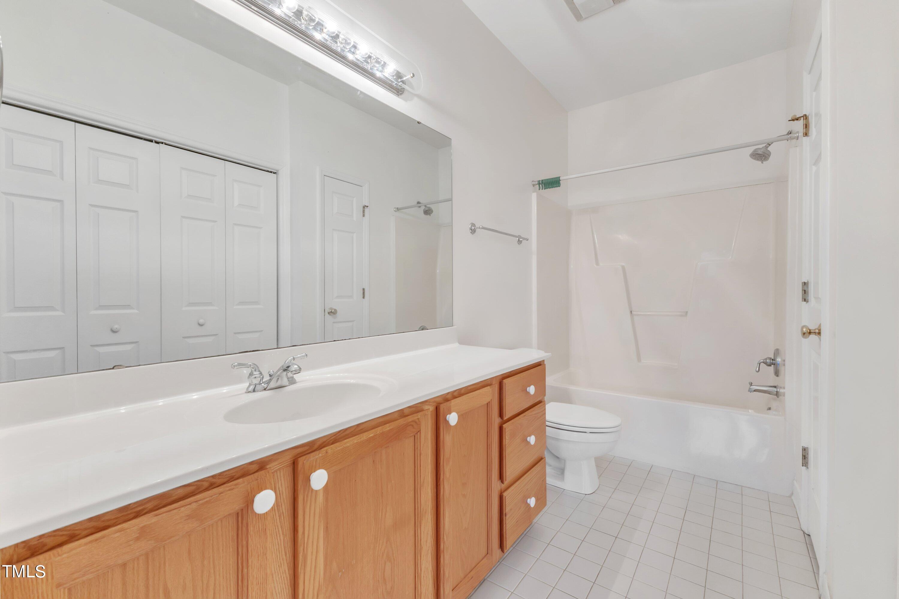 720 North Person Street, Unit 306 Raleigh, NC 27604 - Photo 10 of 13 a bathroom with a sink a toilet and shower