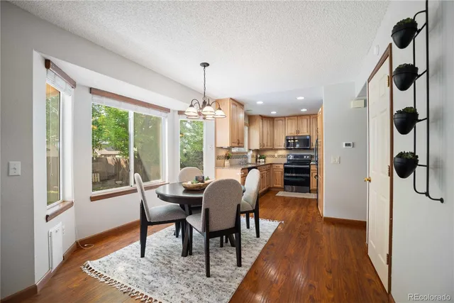 a view of a dining room with furniture window and wooden floor