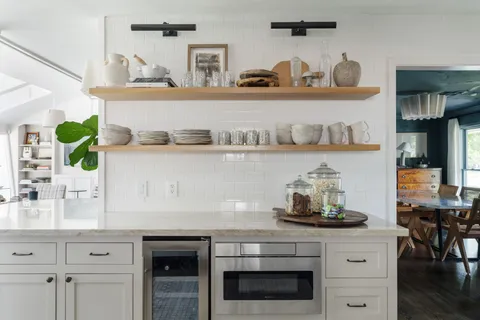 a kitchen with a stove and cabinets