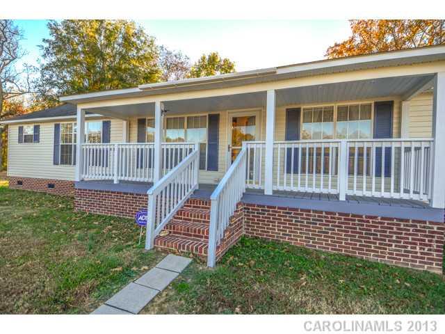 4520 Plyler Mill Road Monroe, NC 28112 - Photo 1 of 16 a front view of a house with a garden