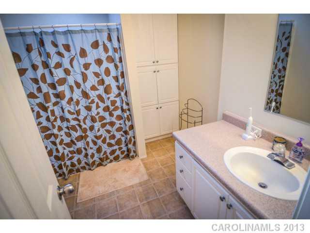 4520 Plyler Mill Road Monroe, NC 28112 - Photo 13 of 16 a bathroom with a sink and a mirror