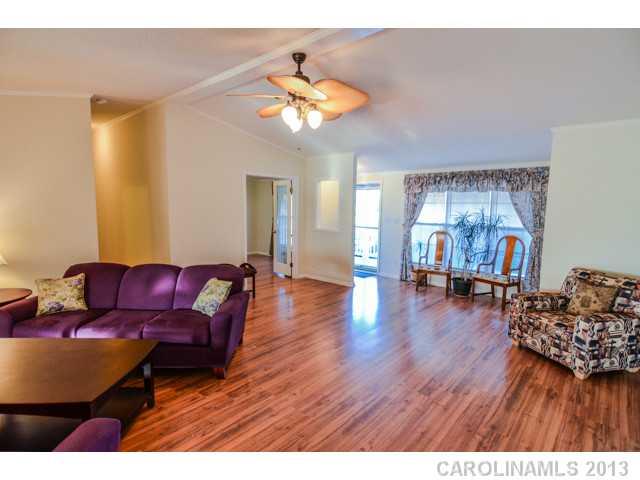 4520 Plyler Mill Road Monroe, NC 28112 - Photo 5 of 16 a living room with furniture and a wooden floor