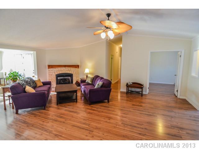 4520 Plyler Mill Road Monroe, NC 28112 - Photo 6 of 16 a living room with furniture and a fireplace