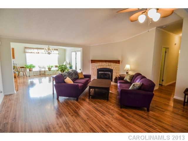 4520 Plyler Mill Road Monroe, NC 28112 - Photo 7 of 16 a living room with furniture and a fireplace