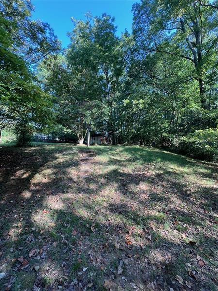 3743 Jiles Road Kennesaw, GA 30144 - Photo 17 of 21 a view of outdoor space with trees all around