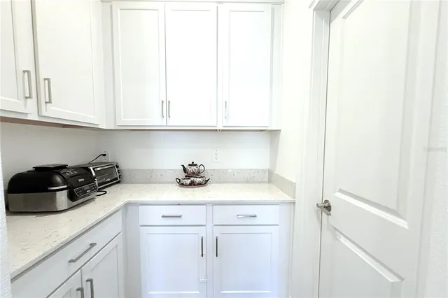 a kitchen with a sink and cabinets