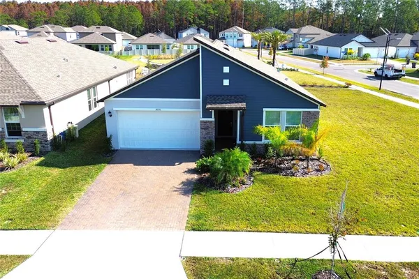 a view of a house with a yard