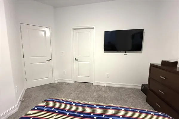 a living room with a flat screen tv and a fireplace