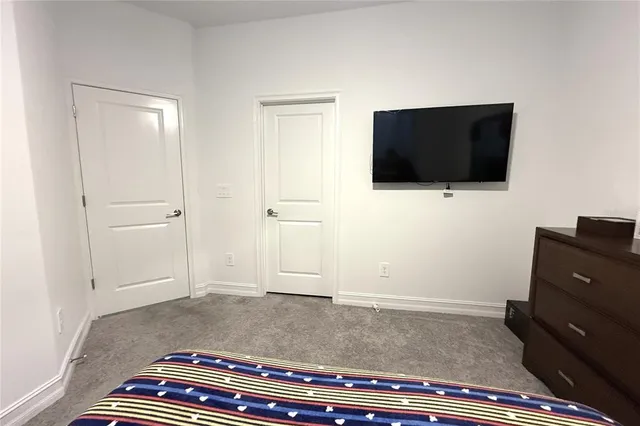 a living room with a flat screen tv and a fireplace
