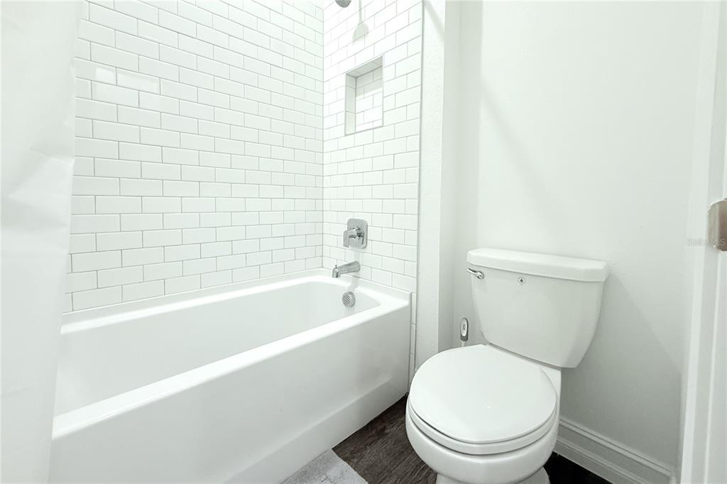 18331 Serene Lk Loop Lutz, FL 33548 - Photo 39 of 46 a white toilet sitting next to a bathtub