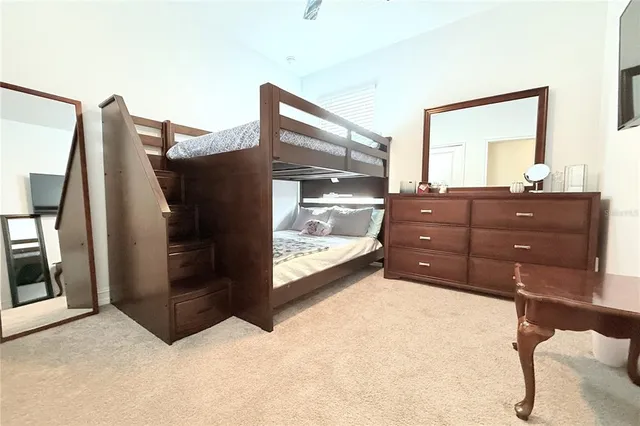 a room with a dresser and a mirror