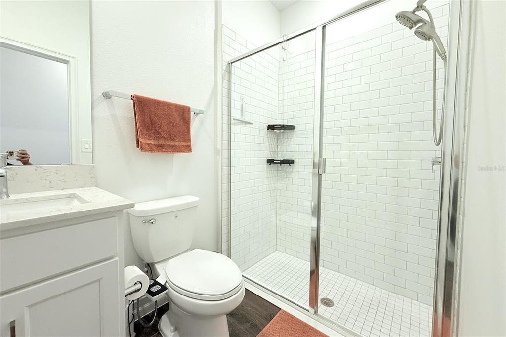 18331 Serene Lk Loop Lutz, FL 33548 - Photo 45 of 46 a bathroom with a toilet and shower