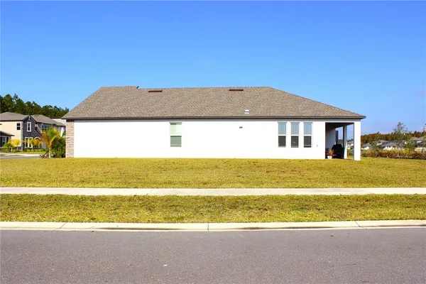 a view of houses with outdoor space and yard