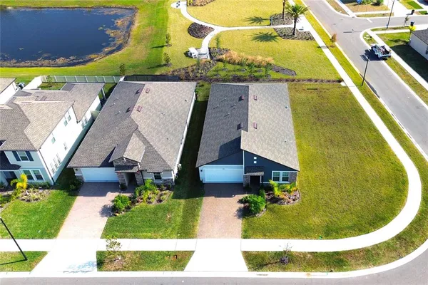an aerial view of a house with a swimming pool