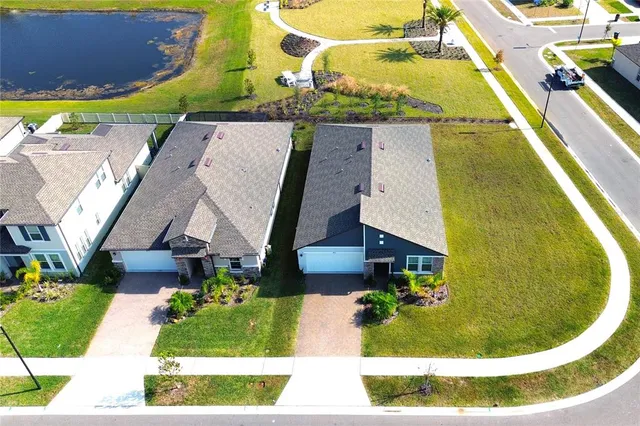 an aerial view of a house with a swimming pool