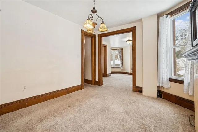 a kitchen with stainless steel appliances granite countertop a stove top oven a sink and dishwasher a refrigerator with wooden cabinets