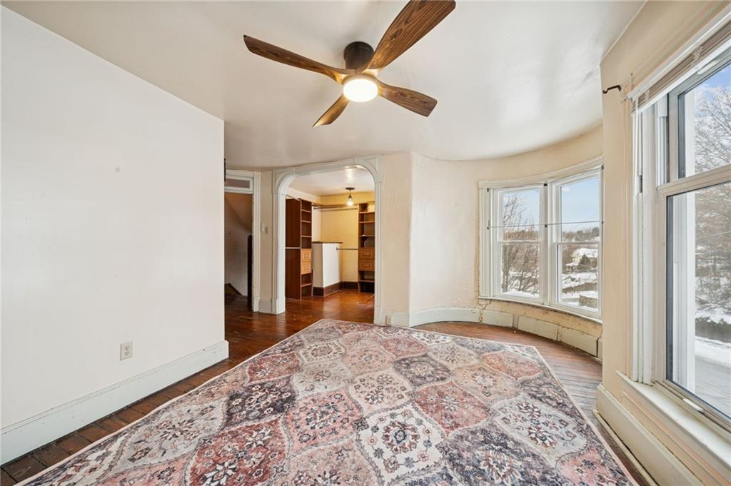 410 Point Street Saltsburg, PA 15681 - Photo 21 of 39 a view of a big room with wooden floor and windows