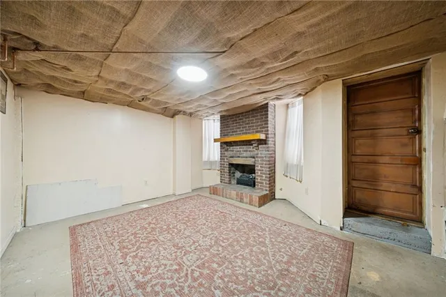 a front view of a house with a bench