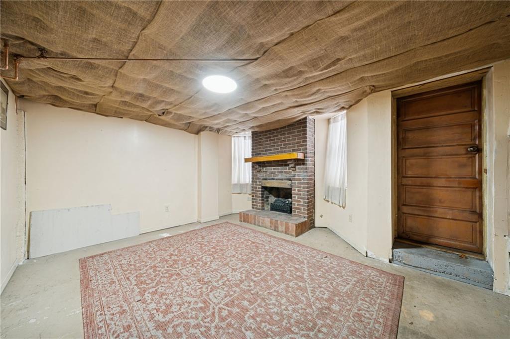 410 Point Street Saltsburg, PA 15681 - Photo 30 of 39 a view of empty room with a fireplace and cabinet