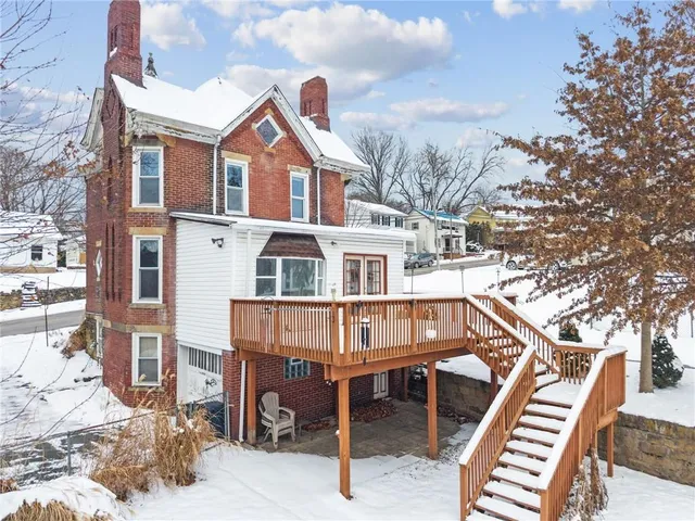 a view of a house with large windows