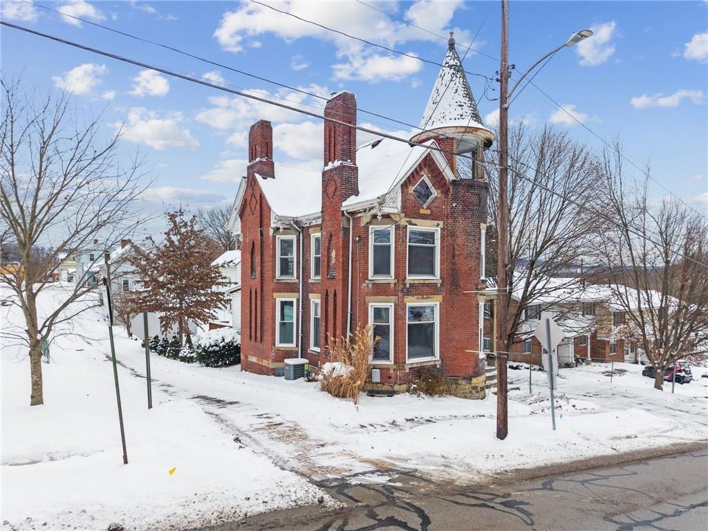410 Point Street Saltsburg, PA 15681 - Photo 37 of 39 a front view of a building with snow on the road