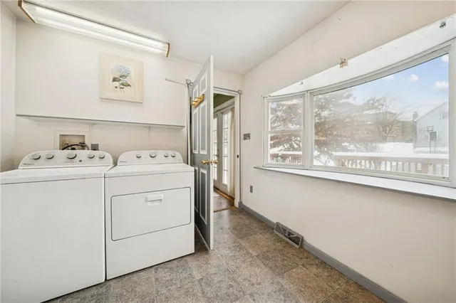 a view of balcony with wooden floor and fence