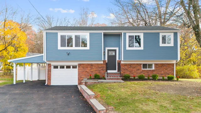 a front view of a house with garden
