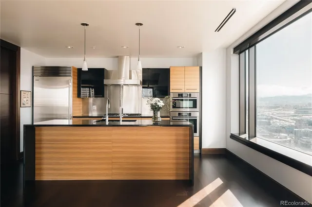 a kitchen with a refrigerator and a stove