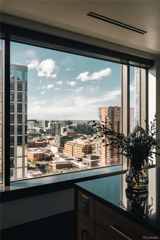 a kitchen with a large window and a sink