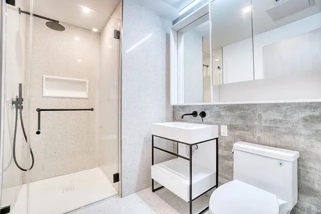 a kitchen with a table chairs and a chandelier