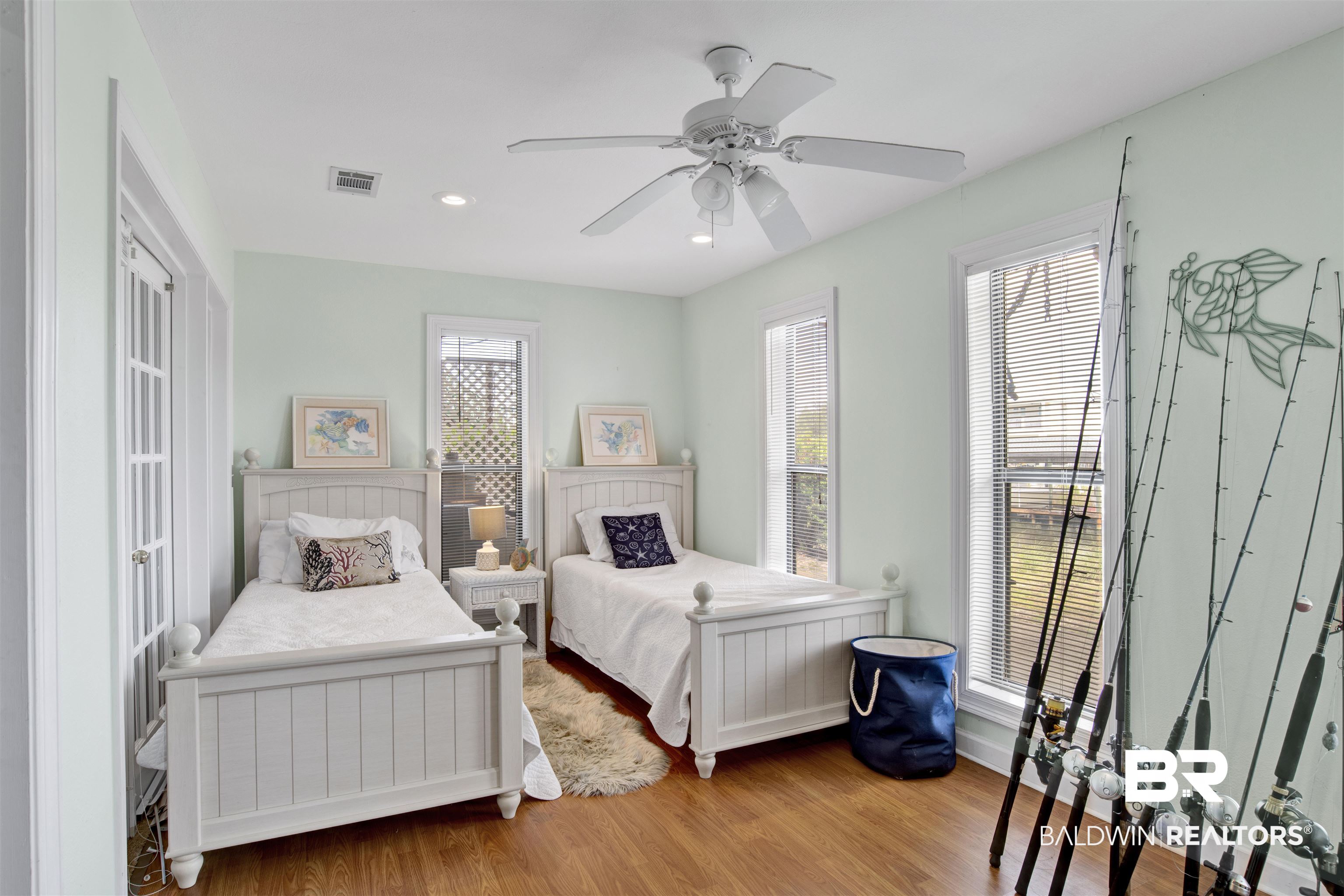 33093 River Road Orange Beach, AL 36561 - Photo 22 of 30 Bedroom featuring light hardwood / wood-style flooring, multiple windows, and ceiling fan