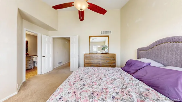 a bedroom with a bed and a dresser