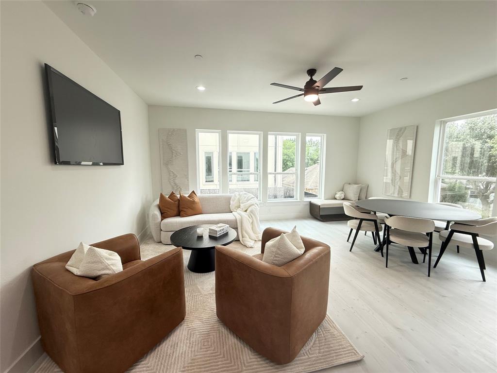 7207 Mohawk Drive, Unit 303 Dallas, TX 75235 - Photo 11 of 23 a living room with furniture ceiling fan and a flat screen tv