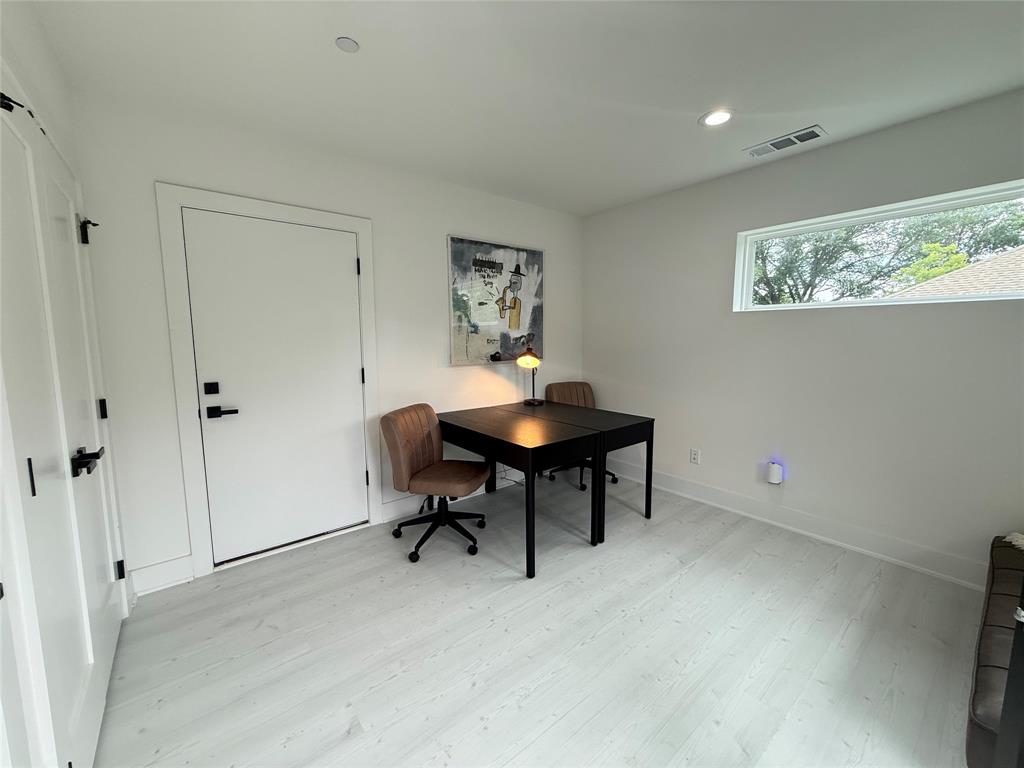 7207 Mohawk Drive, Unit 303 Dallas, TX 75235 - Photo 20 of 23 a workspace with furniture and a window