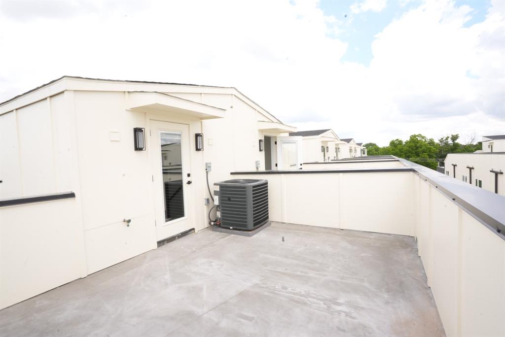 7207 Mohawk Drive, Unit 303 Dallas, TX 75235 - Photo 2 of 23 a view of a living room with a kitchen
