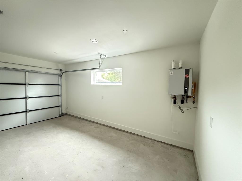 7207 Mohawk Drive, Unit 303 Dallas, TX 75235 - Photo 23 of 23 wooden floor in an empty room with a window