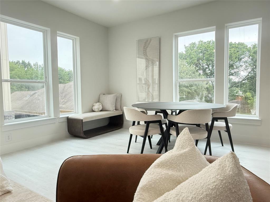 7207 Mohawk Drive, Unit 303 Dallas, TX 75235 - Photo 7 of 23 a living room with furniture and a window