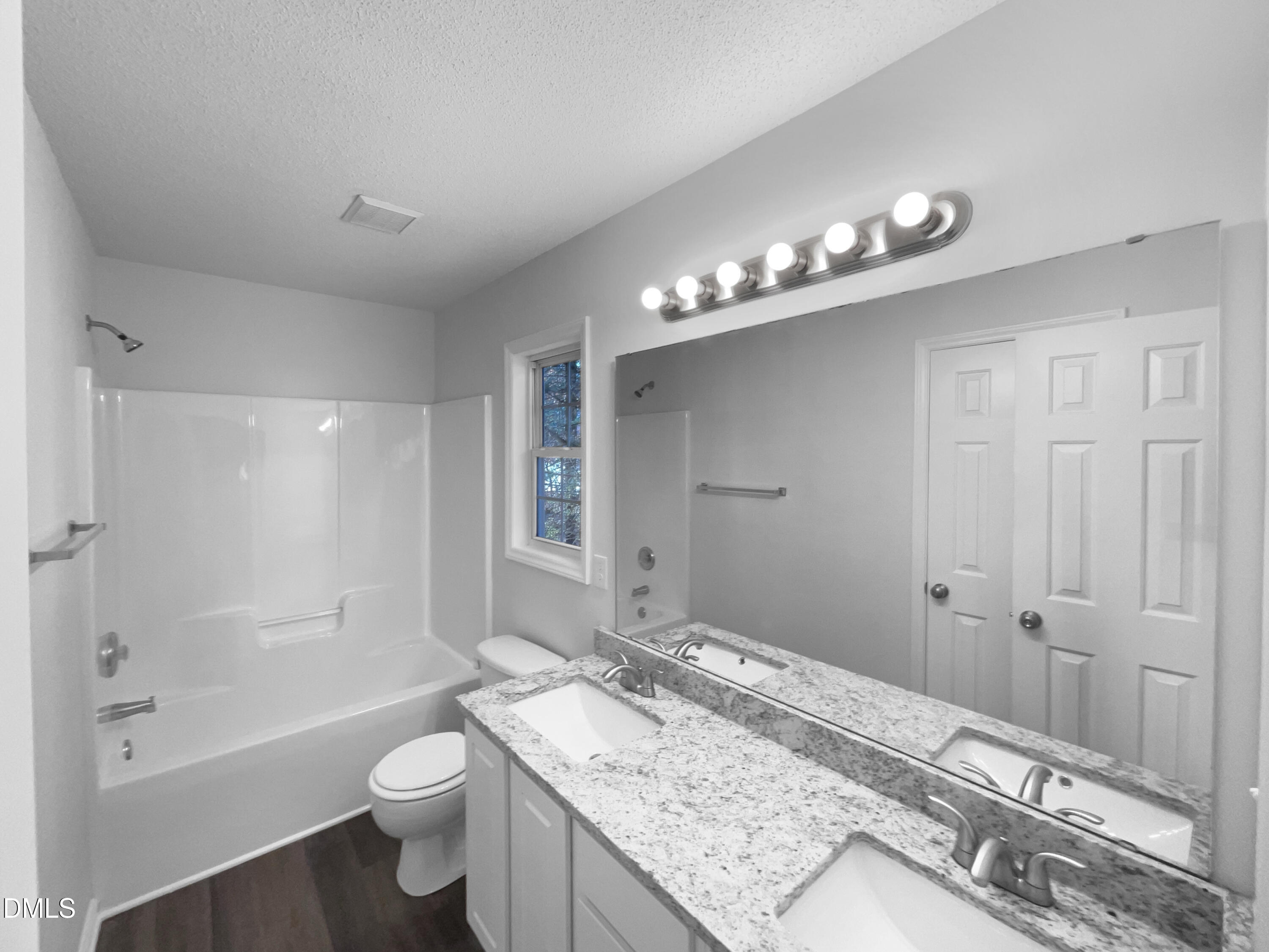 5901 Presentation Street Knightdale, NC 27545 - Photo 6 of 16 a bathroom with a granite countertop sink a toilet and shower