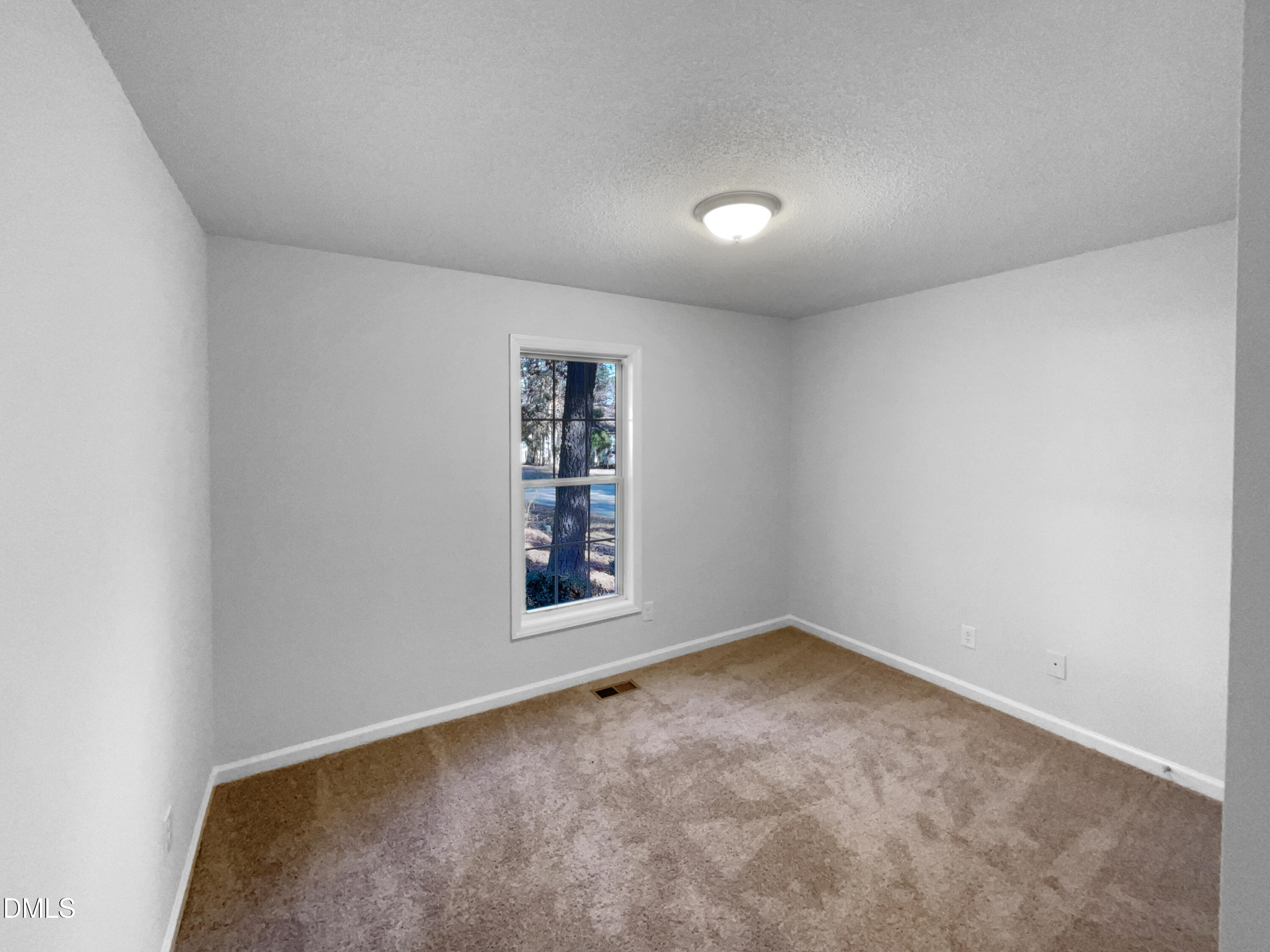 5901 Presentation Street Knightdale, NC 27545 - Photo 8 of 16 an empty room with windows