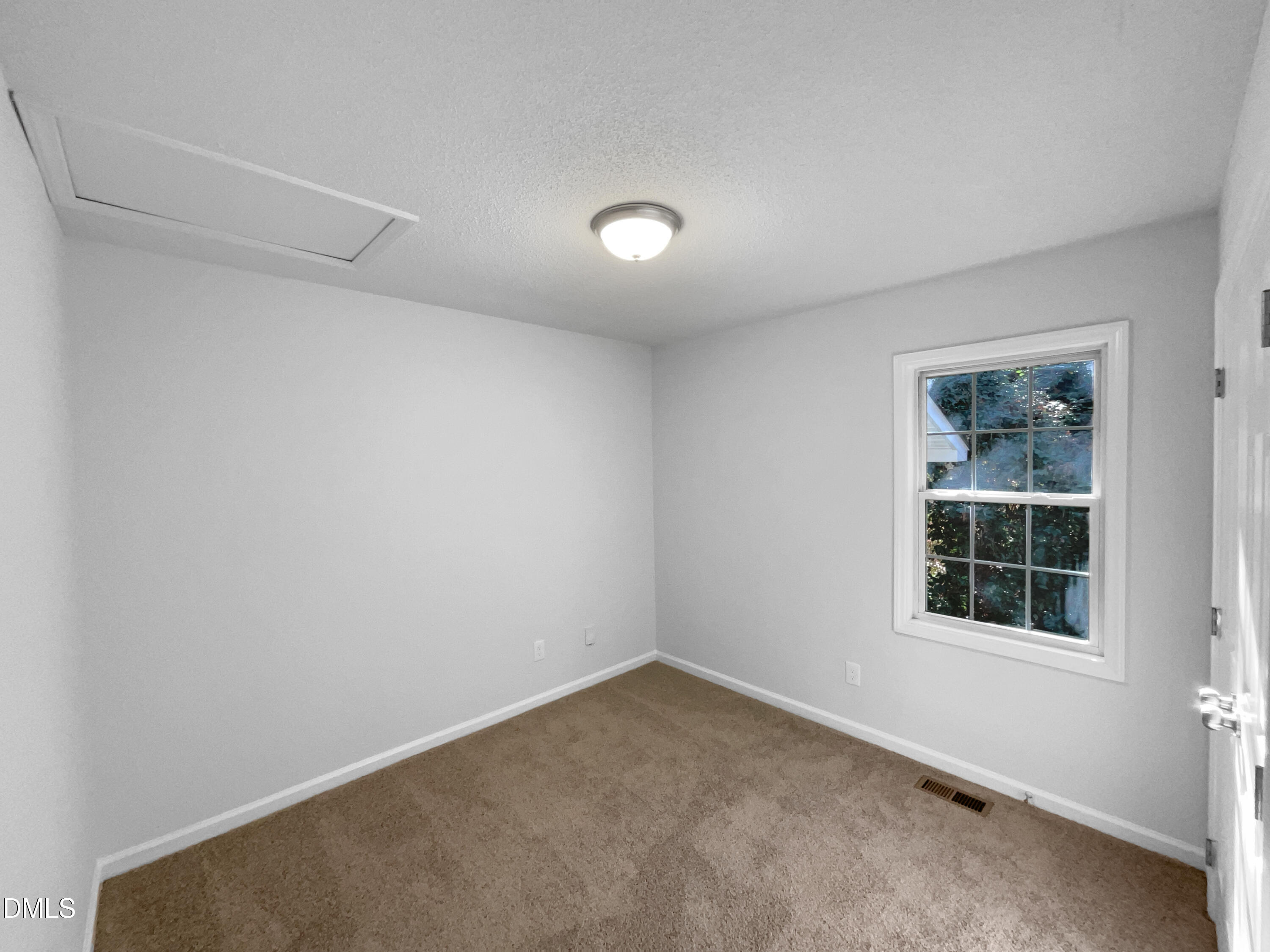 5901 Presentation Street Knightdale, NC 27545 - Photo 9 of 16 an empty room with a window
