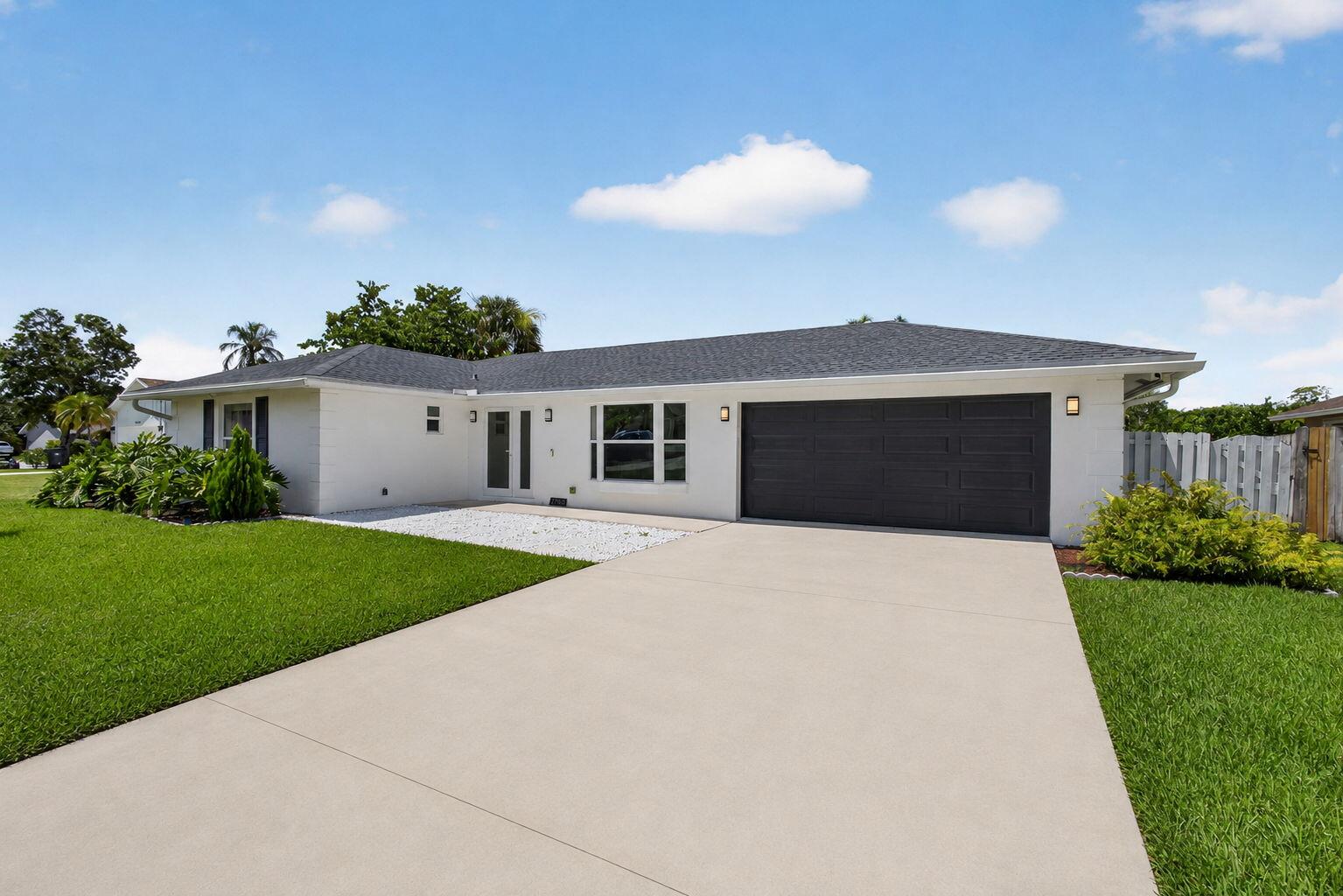 11760 Inverness Circle Wellington, FL 33414 - Photo 1 of 24 78-web-or-mls-driveway2