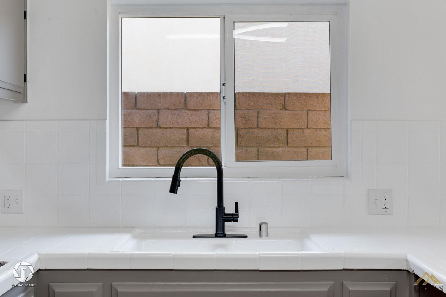 Undisclosed Address Bakersfield, CA 93308 - Photo 12 of 27 a bathroom with a sink and a window