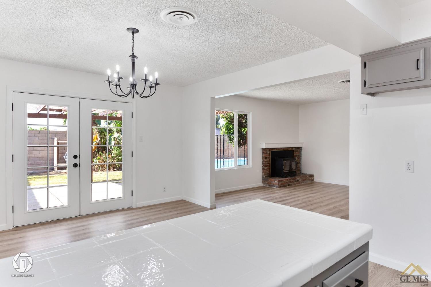 Undisclosed Address Bakersfield, CA 93308 - Photo 13 of 27 a view of a livingroom with a chandelier