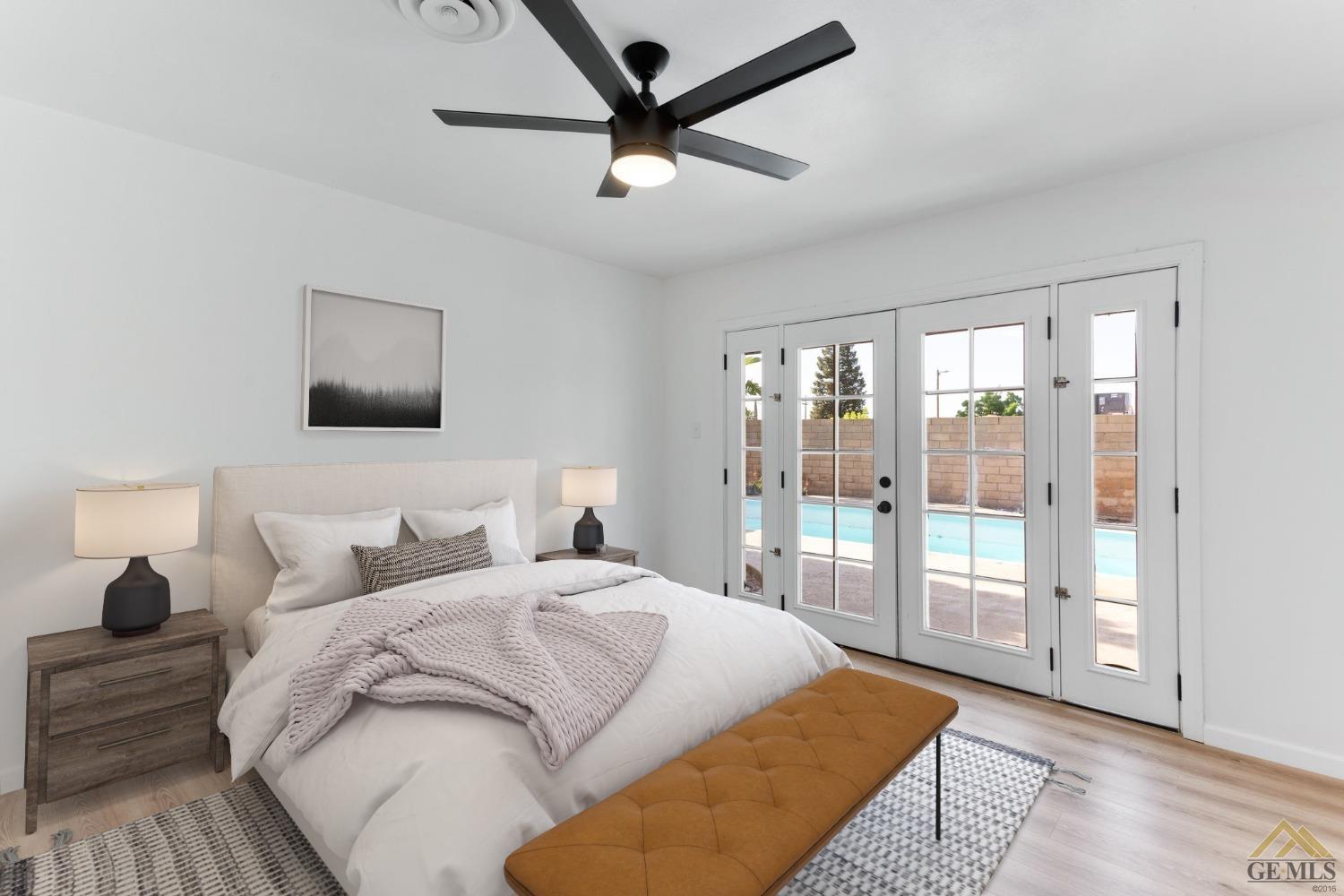 Undisclosed Address Bakersfield, CA 93308 - Photo 14 of 27 a bedroom with a large bed and a large window