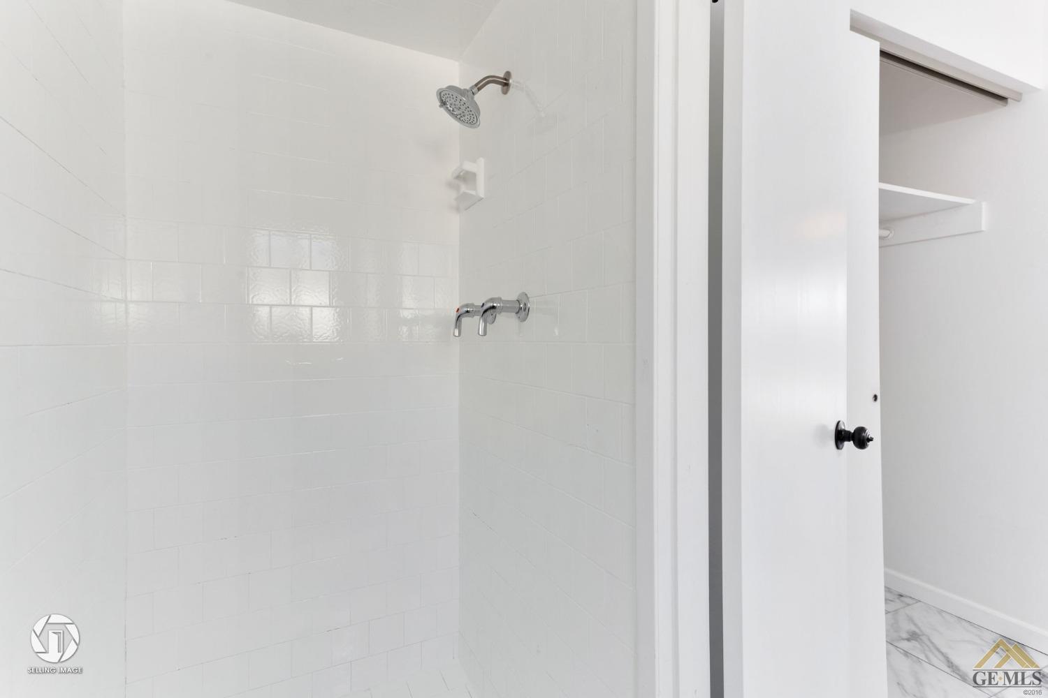 Undisclosed Address Bakersfield, CA 93308 - Photo 17 of 27 a bathroom with a shower