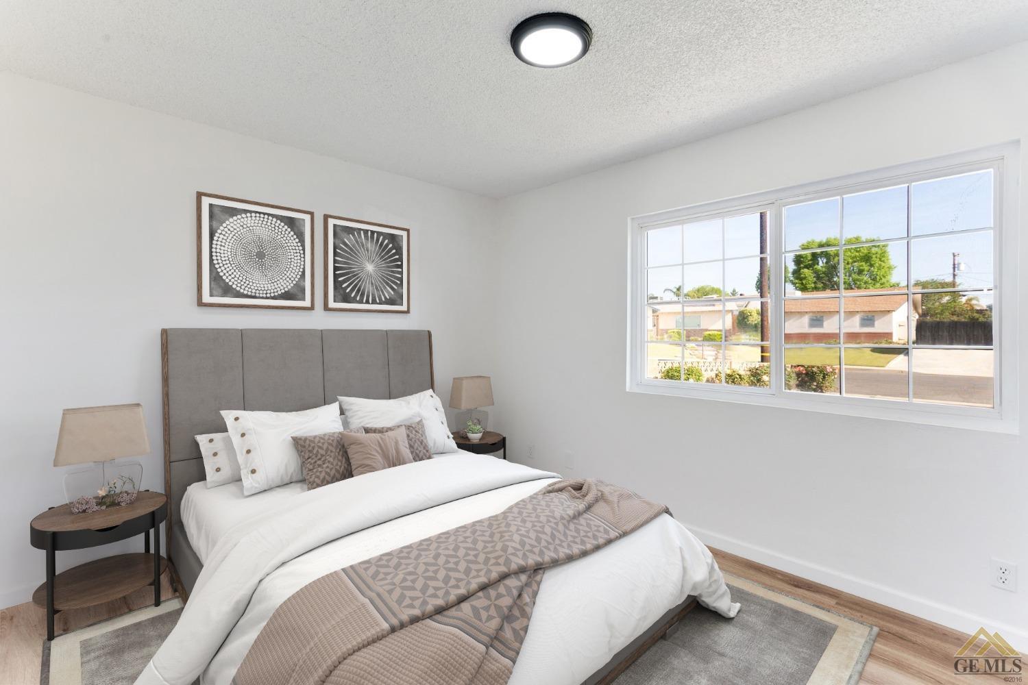 Undisclosed Address Bakersfield, CA 93308 - Photo 18 of 27 a bedroom with a bed and window