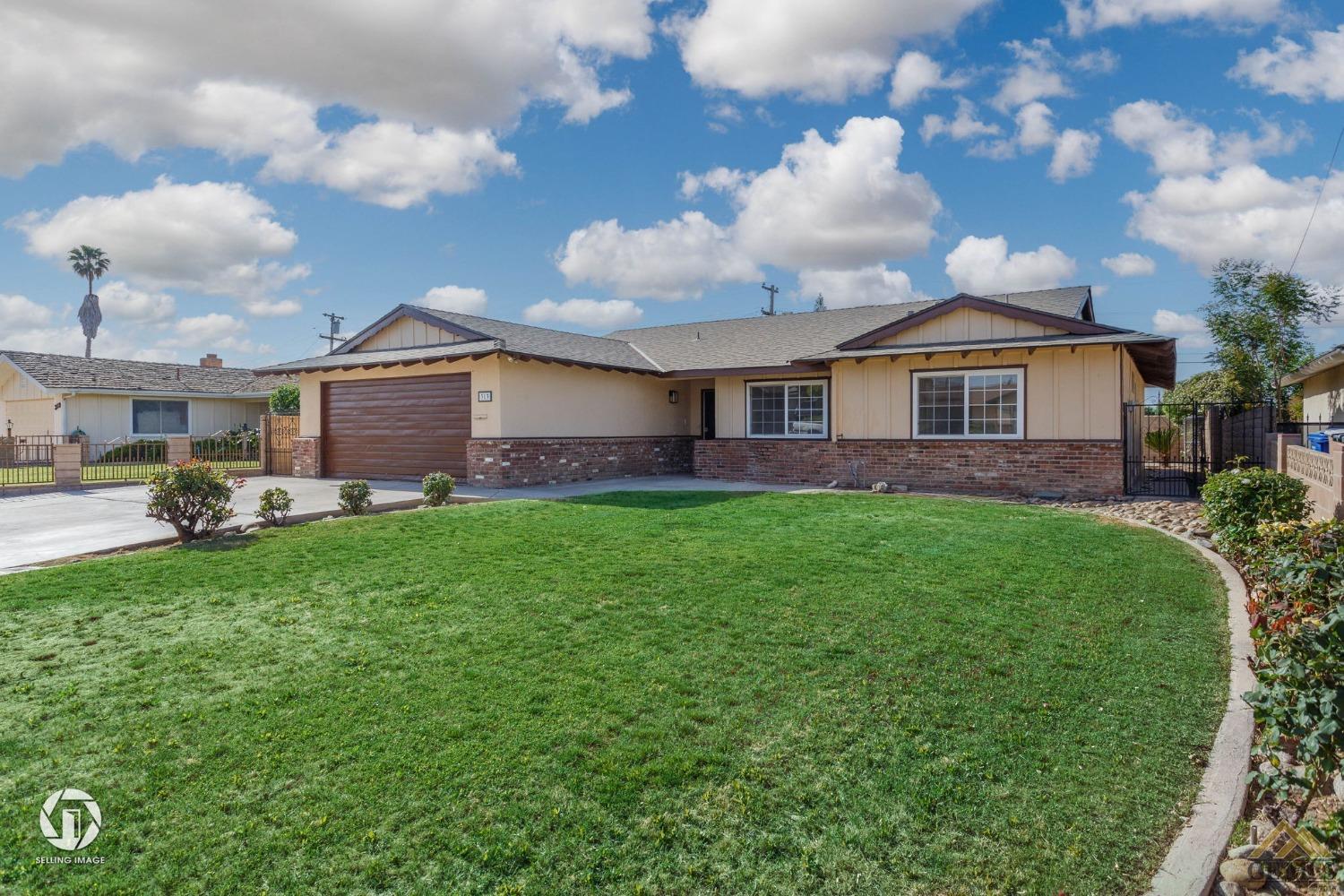 Undisclosed Address Bakersfield, CA 93308 - Photo 2 of 27 a view of a house with a back yard