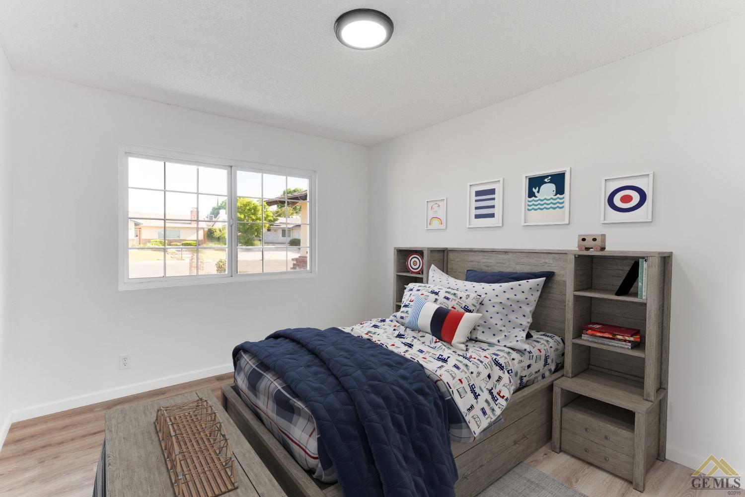 Undisclosed Address Bakersfield, CA 93308 - Photo 21 of 27 a bedroom with a bed and a window